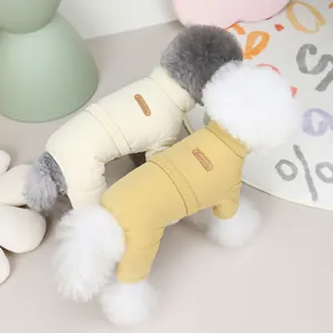 Quilted pet jumpsuit for dogs and cats featuring a stylish brown leather logo tag
