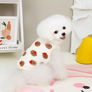 Quilted beige pet vest with bear print for cats and small dogs in a cozy home setting