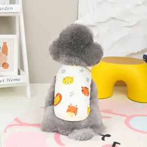 Detailed view of quilted cotton pet vest with cute cartoon animal prints on a poodle