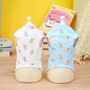Cute pet vests with pink peach patterns in white and light blue on model stands