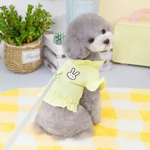 Yellow pet dog shirt with ruffled edges and rabbit embroidery featuring a leash D-ring