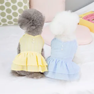 Robes chic pour chiens jaunes et bleues avec boutons de perles et jupes à volants