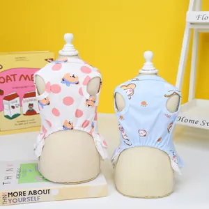 Details von Hunde-Sommerkleidern mit Bärenprints und weißem Spitzenbesatz auf Gelb