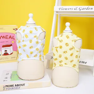 Detail of cotton pet vests with cartoon bear prints in light blue and yellow
