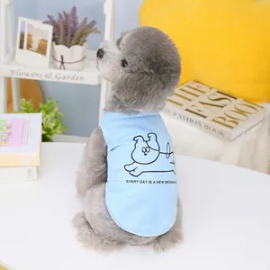 Detail of light blue cotton dog vest featuring a cartoon illustration and English slogan