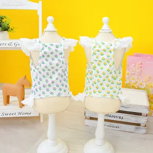 Detail of knit pet camisoles with tulip prints and delicate white lace ruffles