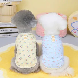 Floral waffle knit pet vests in yellow and blue with wooden buttons for small dogs