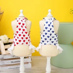 Close-up of heart print pet dress set featuring back buttons and lace ruffle trim details