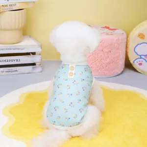 Detail of blue floral pet vest with waffle texture and wooden buttons for small dogs