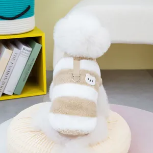 Close-up of plush striped pet vest with cute bear embroidery and metal D-ring attachment