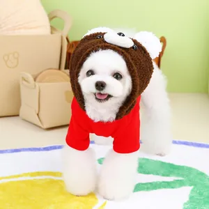 Cute pet hoodie set with red T-shirt and brown bear hood modeled in cozy home setting