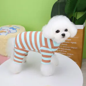 Blue and brown striped four-legged pet pajamas for small dogs on a green background