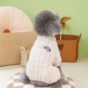 Detail of soft plush pet fleece vest with metal D-ring for leash and dog embroidery