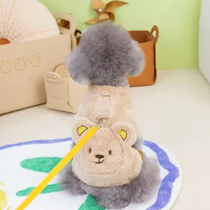 Detail of plush beige pet fleece vest with bear pocket and yellow leash attachment