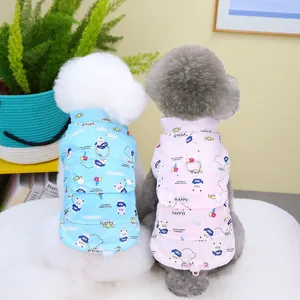Quilted pet winter vests in pink and blue with cartoon prints and D-ring harness
