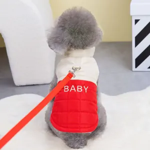 Detail of red and cream pet puffer vest with D-ring and BABY embroidery on back