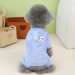 Detail of light blue plush pet coat with D-ring harness and cartoon dog embroidery