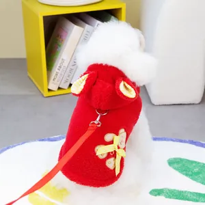 Detail of red fleece pet hoodie with cute bear patch, yellow bow, and matching leash set