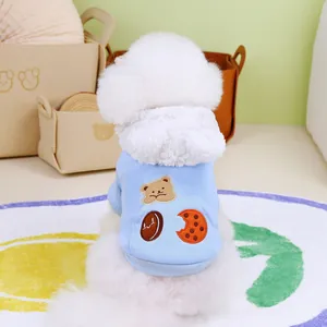 Detail of light blue pet hoodie with bear pattern and soft white fleece hood lining