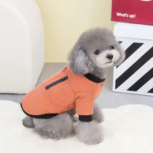 Vibrant orange pet winter coat with zipper pocket and D-ring on grey poodle dog
