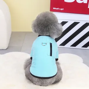 Close-up of light blue pet vest featuring a black zipper pocket and sturdy D-ring for leashes