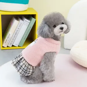 Pink fleece dog dress with grey plaid skirt and harness ring for small pets