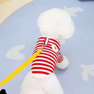 Close-up of red and white striped pet t-shirt with cute bear patch and yellow leash