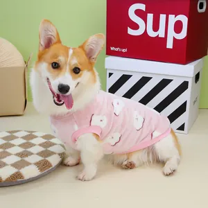 Pink fleece pet vest with white bear patterns on a Corgi for winter warmth
