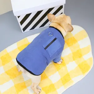 Close-up of blue pet vest with back zipper pocket and metal D-ring on French Bulldog