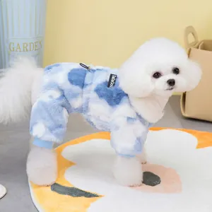 Detailed texture of tie-dye blue cloud dog fleece jumpsuit with ribbed cuffs