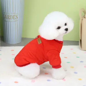 Quilted red pet jacket with D-ring harness for cats and dogs on a white dog