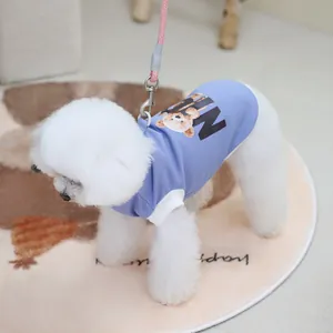 Detail of lavender waffle cotton pet vest with bear print on a white bichon dog