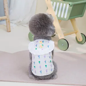 Close-up of floral pet vest with white lace trim and two small yellow 3D flowers