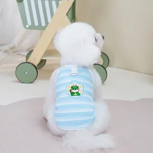 Detail of pet summer vest with blue stripes and embroidered cartoon dragon patch