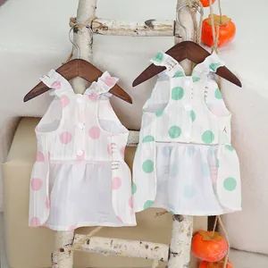 Summer pet dresses with large polka dots and back buttons in pink and green colors