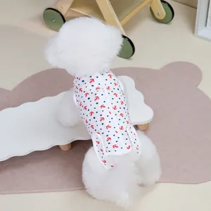 White sailor style pet vest with red anchors and blue stars worn by a small dog