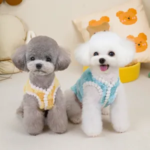 Soft plush pet vest with pom-pom trim in yellow and blue for cats and small dogs