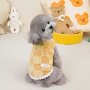 Yellow checkerboard plush dog vest with metal D-ring and decorative white pom-poms