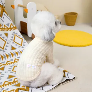 Cream knit sweater for small dogs and cats with vertical rib texture in cozy setting
