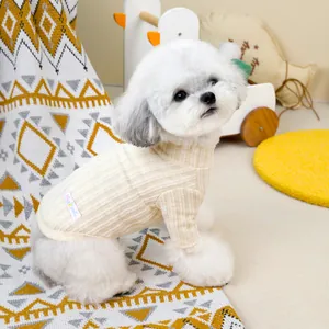 Detail of cream rib-knit pet sweater featuring high neck design and brand label