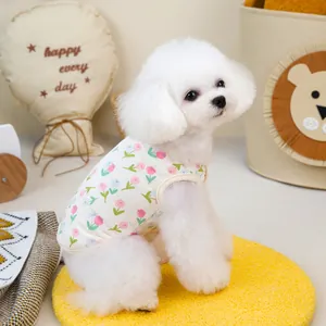Quilted floral pet vest with ribbed trim worn by a white dog in a cozy home setting