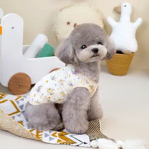 Detail of floral pet vest with diamond quilted texture on a grey poodle