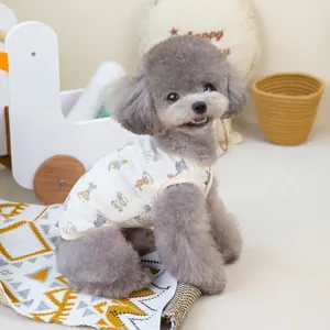 Detailed shot of double-layered cotton pet vest with cute animal print on a grey poodle