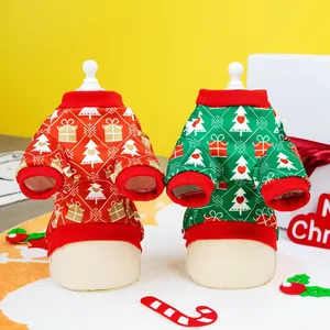Detail of red and green Christmas pet sweaters with argyle pattern and tree embroidery