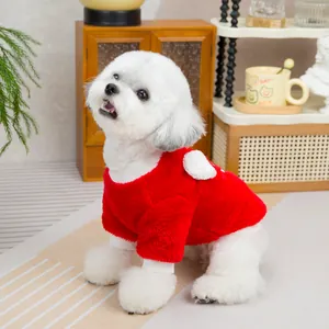 Detail of red plush pet hoodie with white wing decor on a small dog in home setting