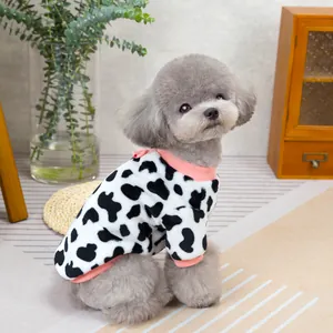 Plush cow print dog clothes with pink trim and bow for small pets like poodles