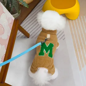 Brown sherpa fleece pet sweater with green letter M and matching blue leash set