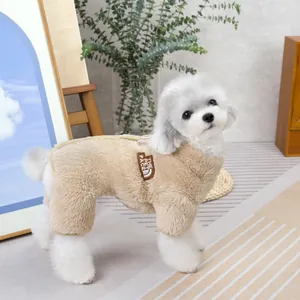 Detail of warm beige fleece pet jumpsuit with THE PET FACE embroidery on white small dog