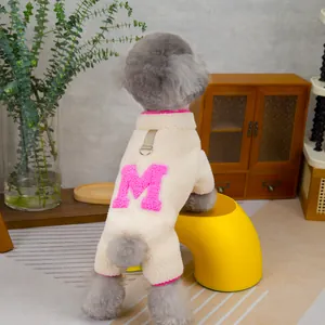 Beige fleece dog jumpsuit with pink M letter patch and metal D-ring for leash attachment