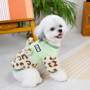 Detail of light green quilted pet vest with leopard print faux shearling sleeves and trim